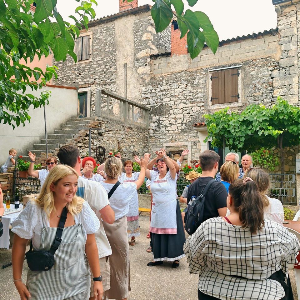 Visitors having fun at the local feast in one of the hidden Croatia gems in Istria